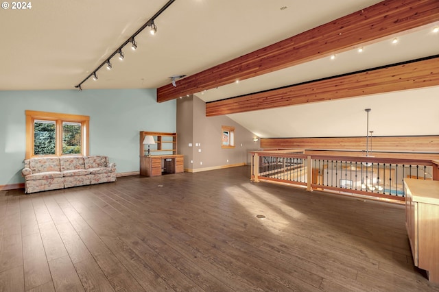 additional living space with vaulted ceiling with beams and dark hardwood / wood-style flooring