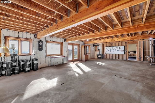 miscellaneous room featuring french doors, concrete floors, and a healthy amount of sunlight