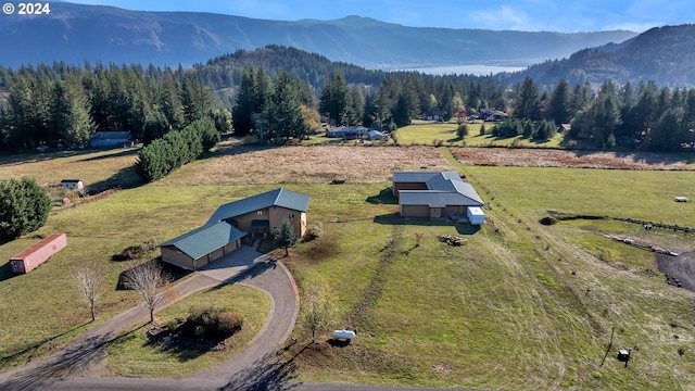 drone / aerial view with a mountain view and a rural view