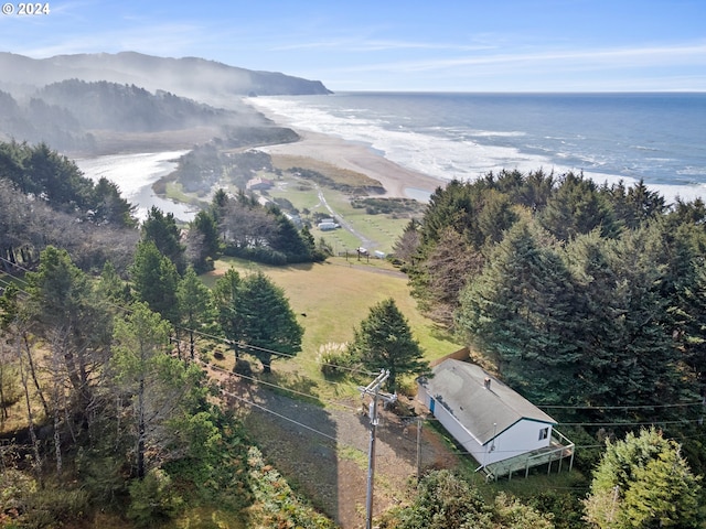 birds eye view of property with a water and mountain view