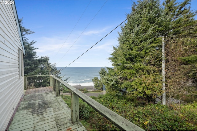 exterior space with a water view and a beach view