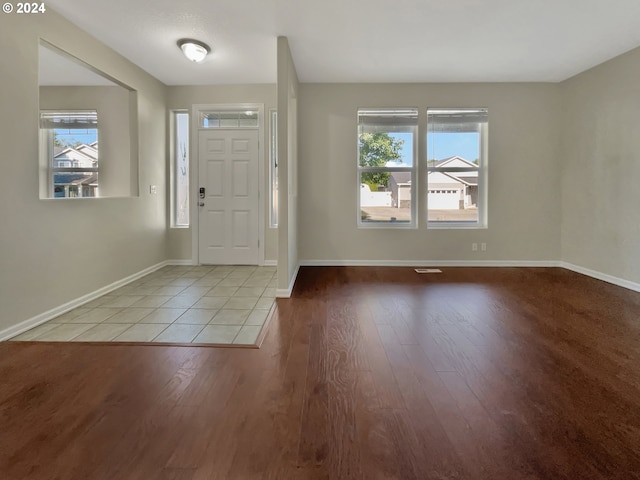 entryway with light tile patterned flooring