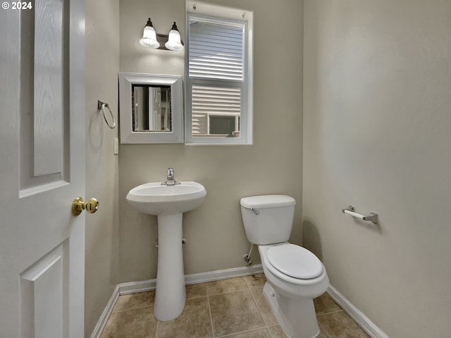 bathroom with tile patterned floors and toilet