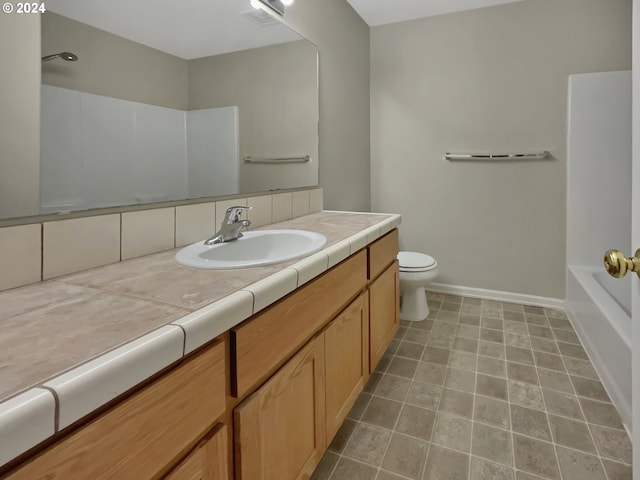 full bathroom featuring washtub / shower combination, backsplash, vanity, and toilet