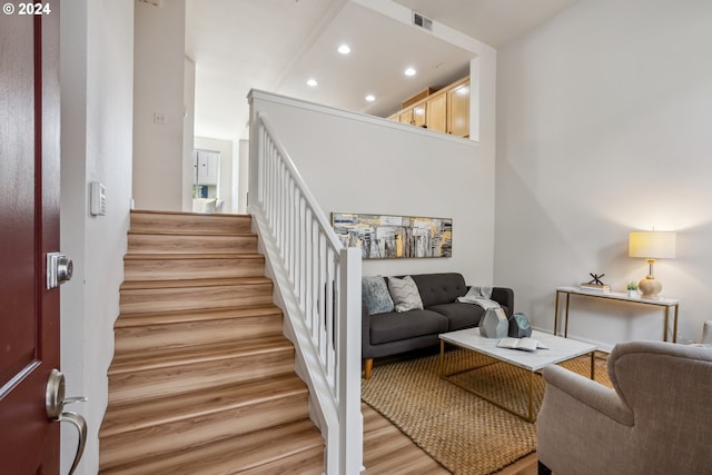 stairway featuring light hardwood / wood-style floors