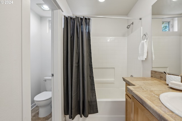 full bathroom featuring shower / tub combo, toilet, and vanity