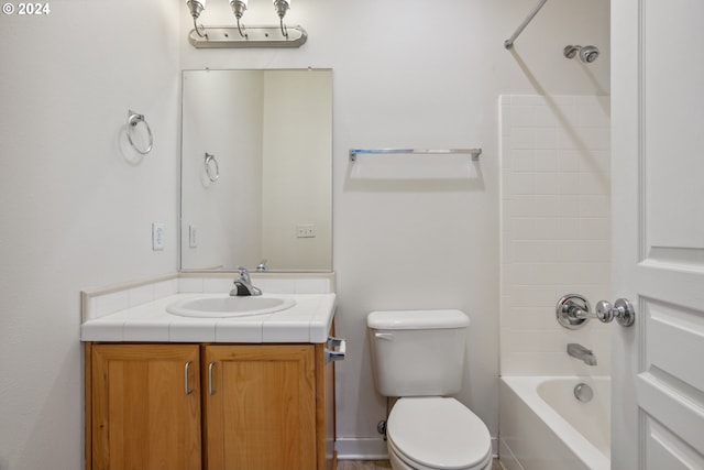 full bathroom with vanity, bathtub / shower combination, and toilet