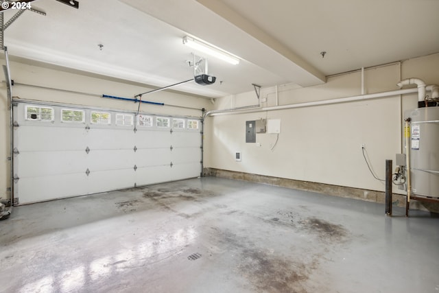 garage with strapped water heater, electric panel, and a garage door opener