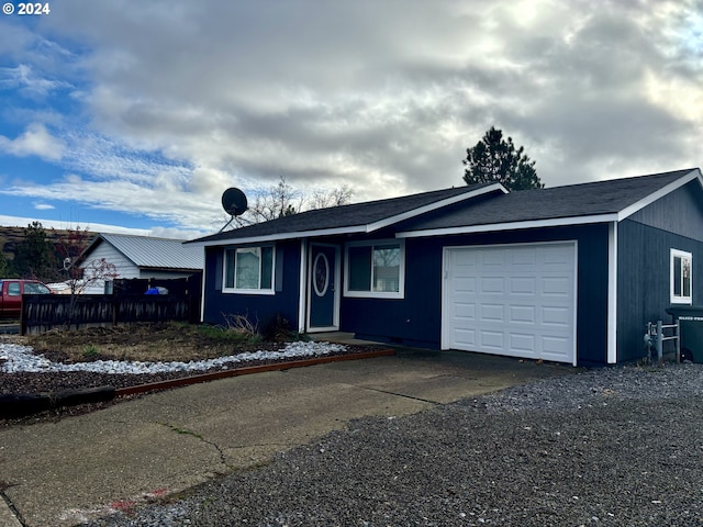 single story home featuring a garage