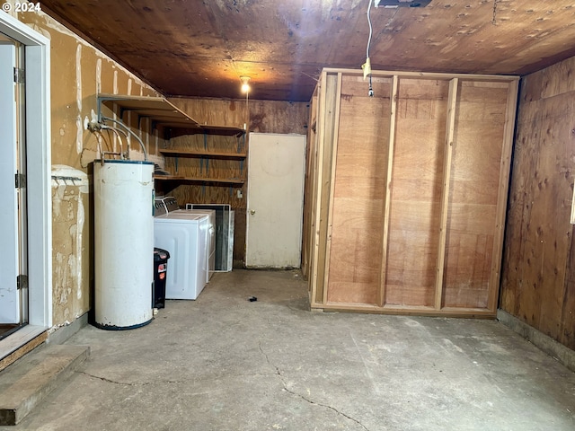 basement with wood ceiling and water heater