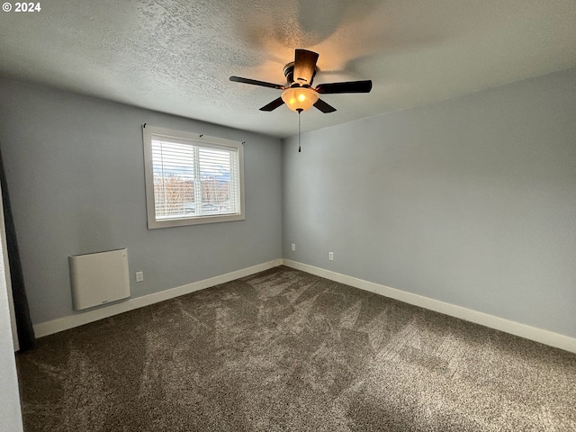 carpeted empty room with a textured ceiling and ceiling fan