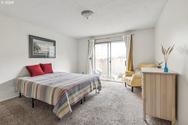 bedroom with carpet floors, a textured ceiling, and access to outside