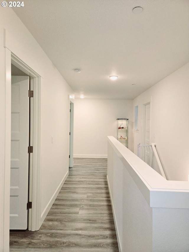 hallway featuring hardwood / wood-style flooring