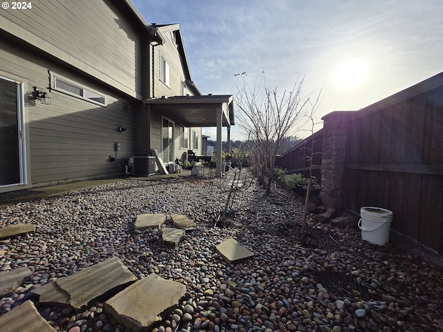 view of yard featuring cooling unit and a patio area