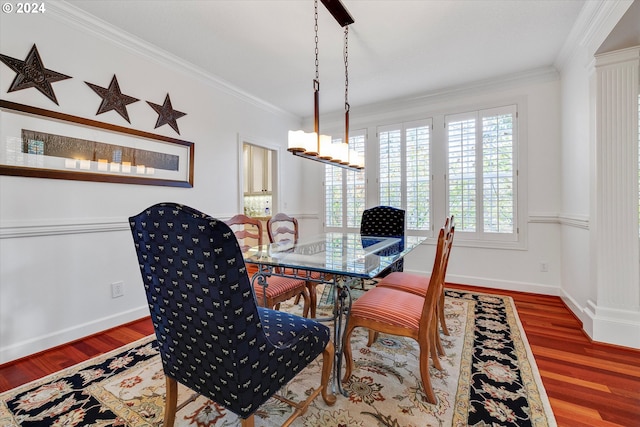 office featuring decorative columns, a textured ceiling, built in desk, a fireplace, and light hardwood / wood-style floors