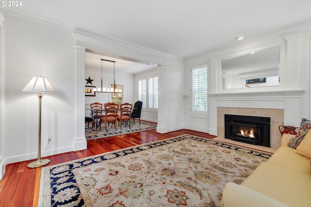 living room with hardwood / wood-style floors and crown molding