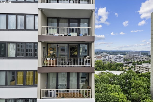 exterior space featuring a balcony and a mountain view