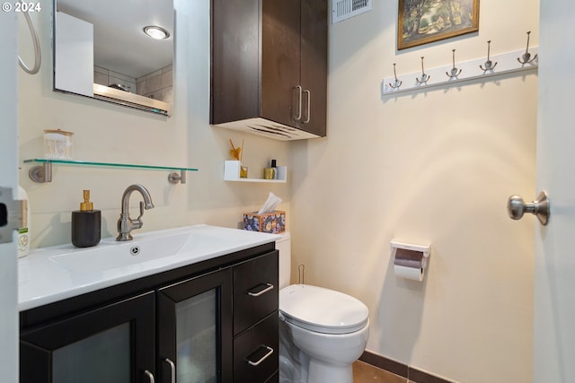 bathroom with vanity and toilet