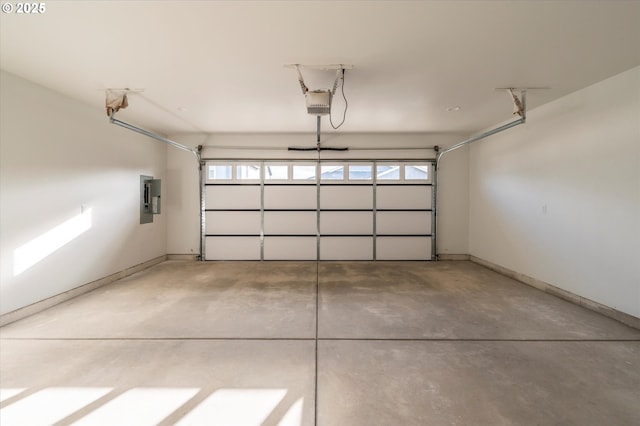 garage with electric panel and a garage door opener