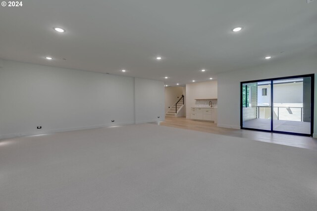 carpeted empty room with sink