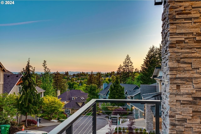 view of balcony at dusk