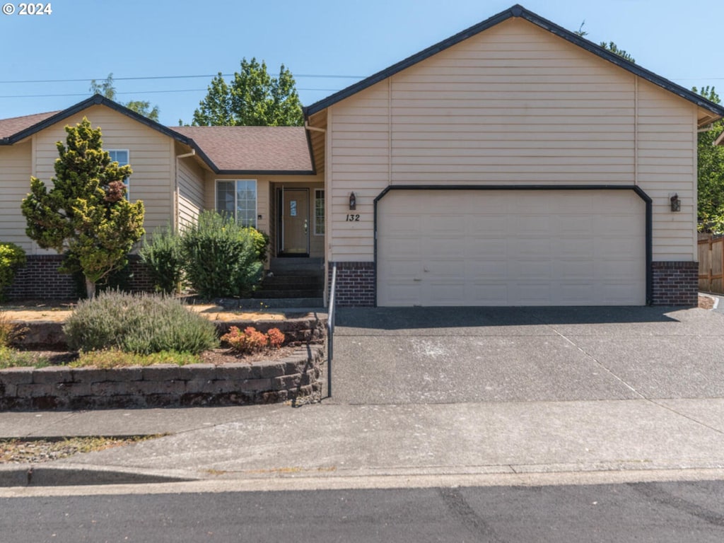 ranch-style house featuring a garage