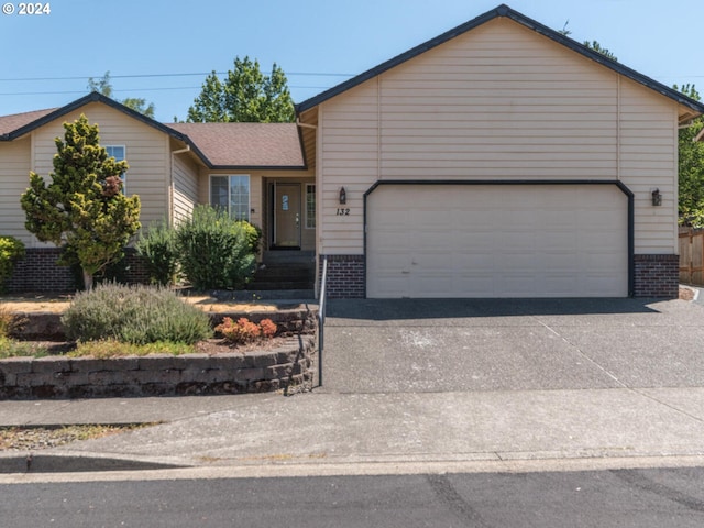 ranch-style house featuring a garage