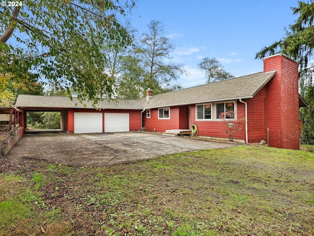 single story home with a front lawn, a garage, and a carport