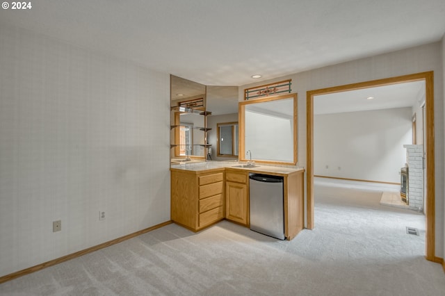 laundry room with washing machine and clothes dryer and cabinets