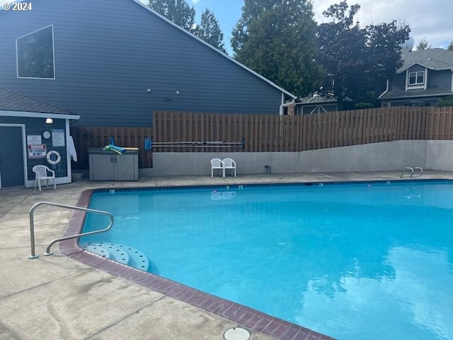 view of pool featuring a patio