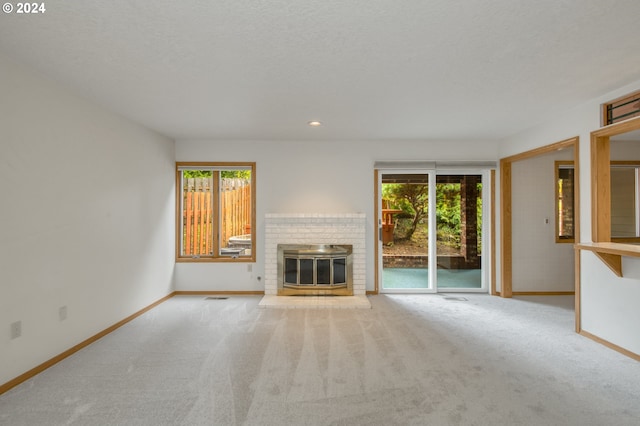 unfurnished living room featuring light colored carpet