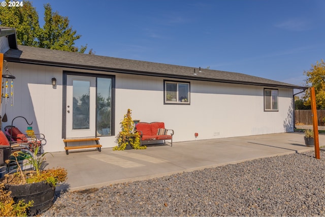 rear view of property featuring a patio area