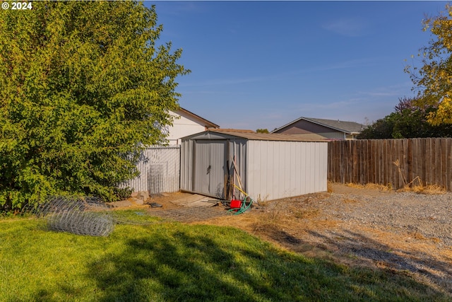 view of outbuilding with a yard