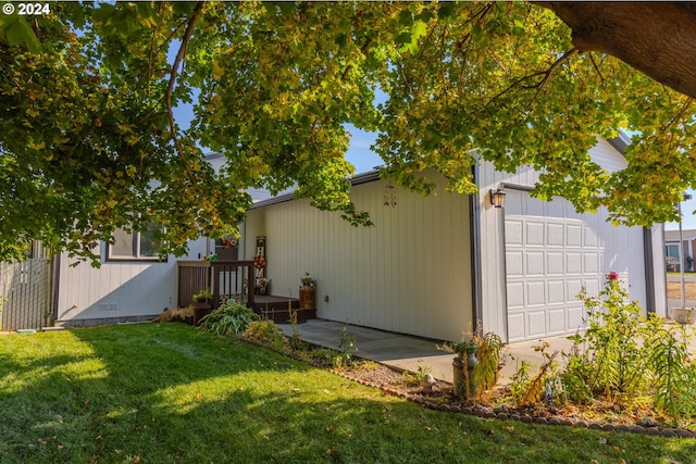 exterior space featuring a deck and a garage