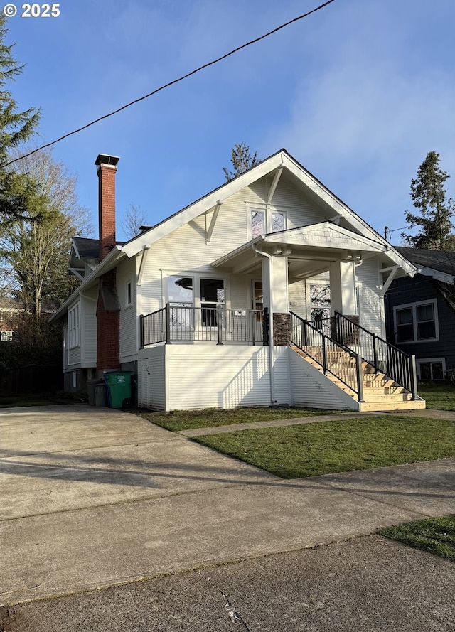 bungalow-style house with a front yard