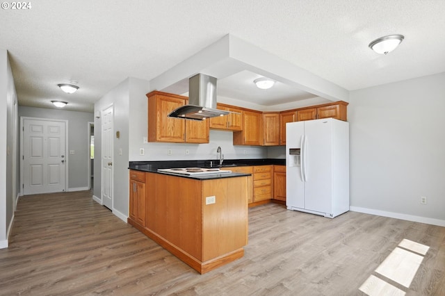 kitchen with a textured ceiling, white appliances, island exhaust hood, kitchen peninsula, and light wood-type flooring