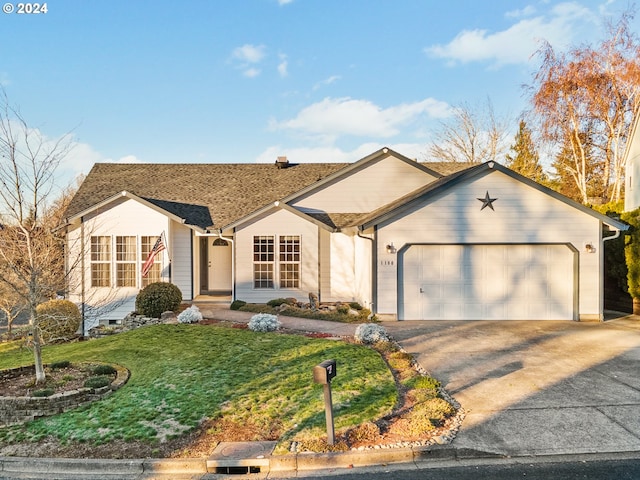 single story home with a garage and a front lawn