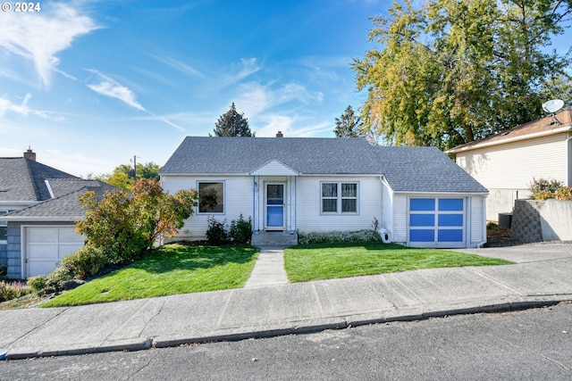 single story home with a front lawn and a garage