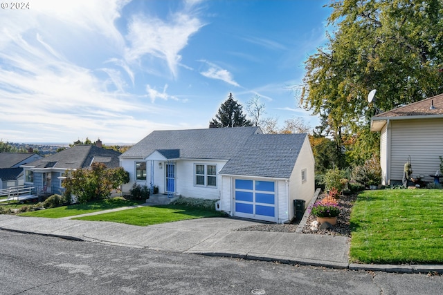 view of front facade with a front lawn and a garage