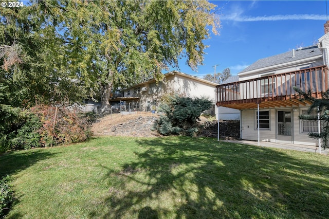 view of yard featuring a wooden deck