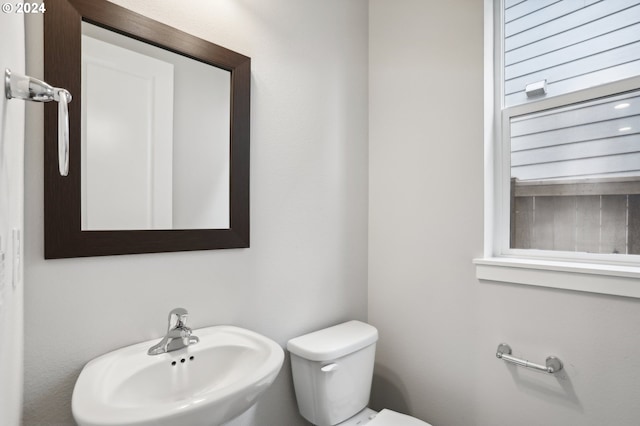 bathroom with toilet and sink