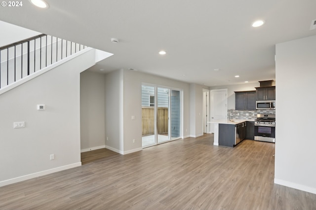 unfurnished living room with light hardwood / wood-style flooring