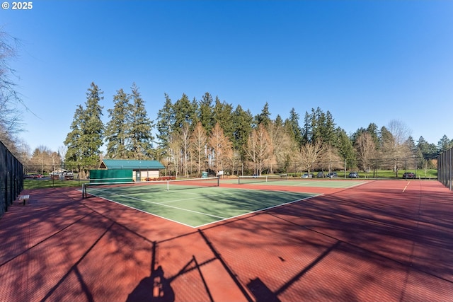 view of sport court with basketball hoop