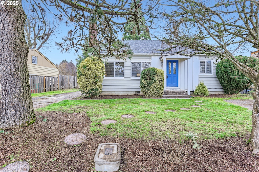 ranch-style house with a front yard