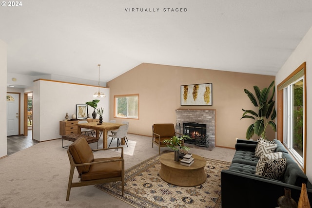 living room with vaulted ceiling, a chandelier, and carpet flooring