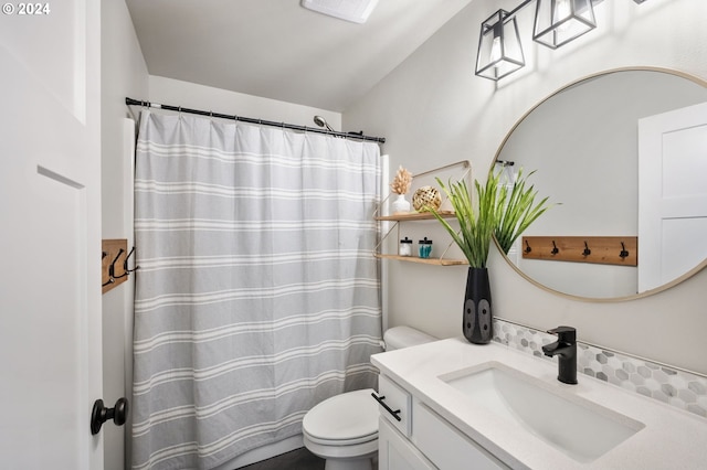 bathroom with vanity, toilet, a shower with shower curtain, and visible vents