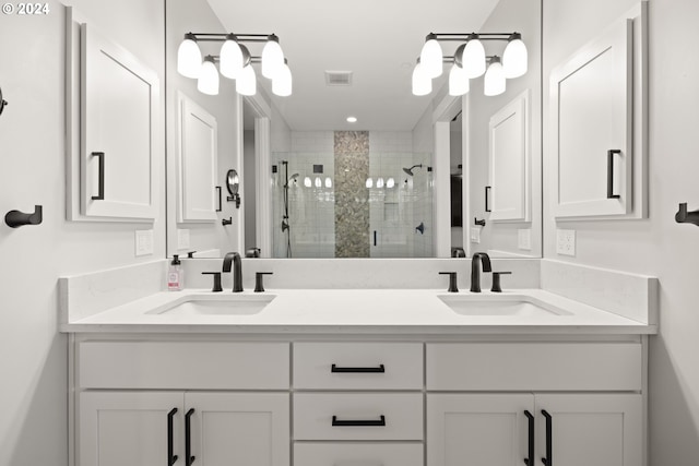 bathroom featuring vanity and a shower with shower door