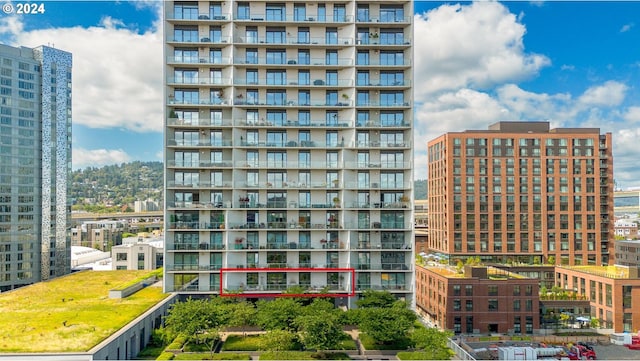 view of building exterior featuring a city view