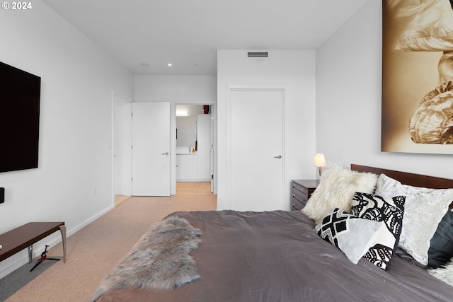 carpeted bedroom featuring visible vents and baseboards