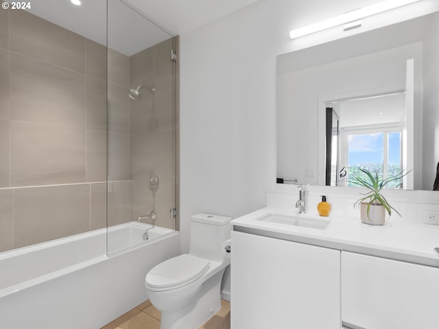 full bathroom with vanity, toilet, tile patterned floors, and tiled shower / bath